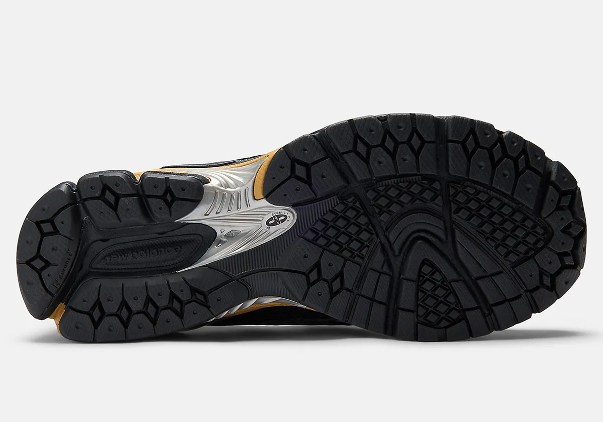 The GANNI x New Balance 1906L Golden Snakeskin Collaboration Revives the Appeal of the Hybrid Runner