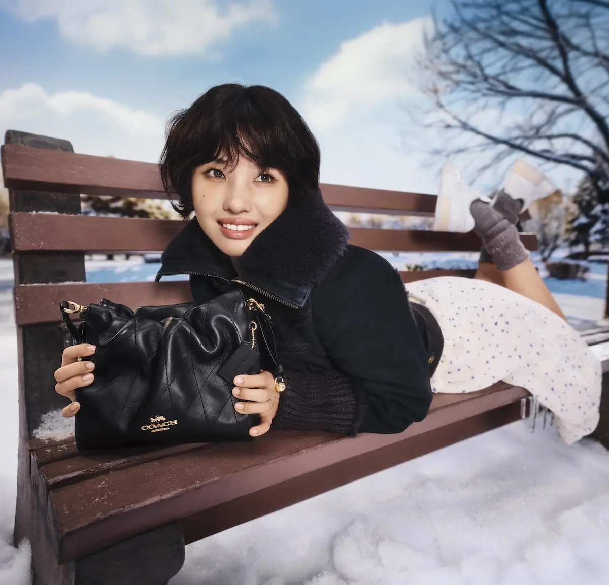 Coach Holiday 2025 campaign: Charles Melton & Elle Fanning lead a quiet luxury journey